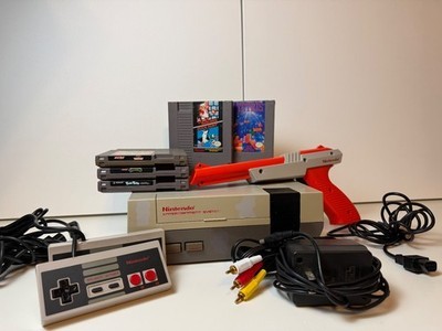 Original Nintendo Entertainment System with controllers, Zapper, and games