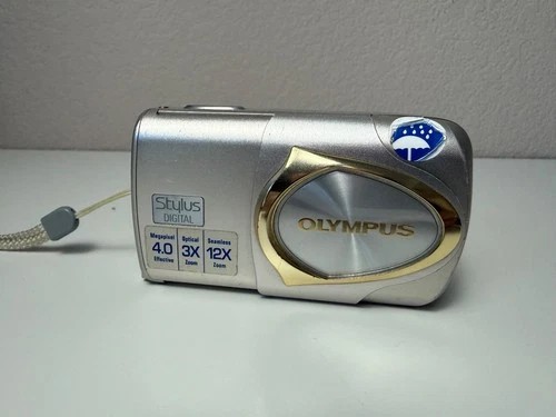 Silver and gold Olympus Stylus 410 digital camera